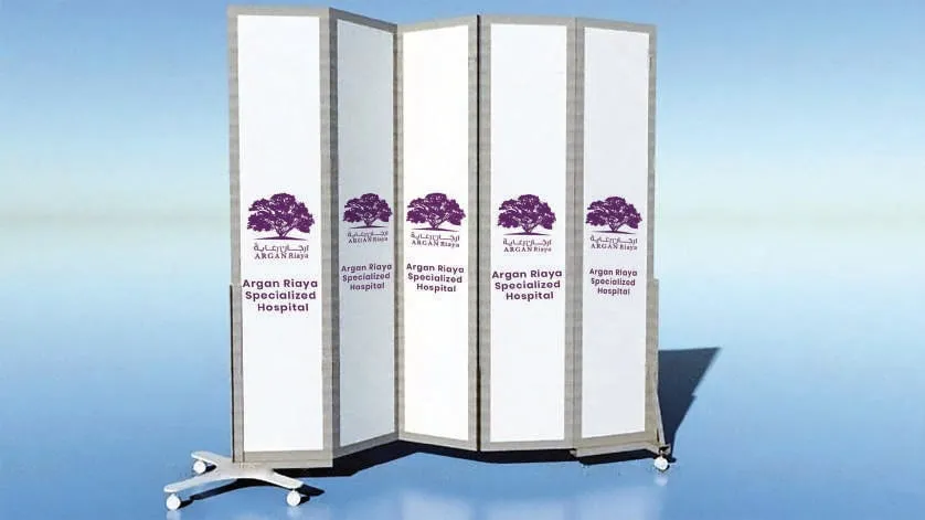 3D render of a five-panel folding screen printed with the purple tree logo of Argan Riaya Specialized Hospital