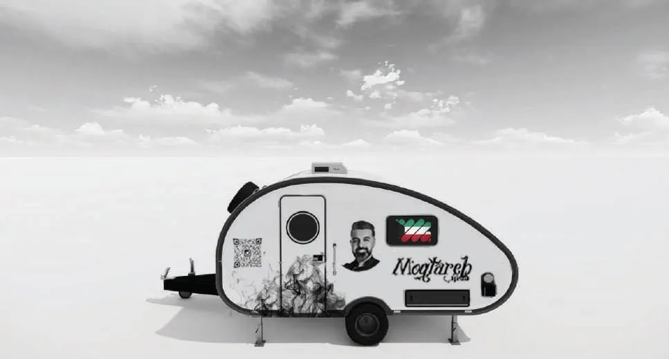 The caravan with an alternative sticker featuring a portrait