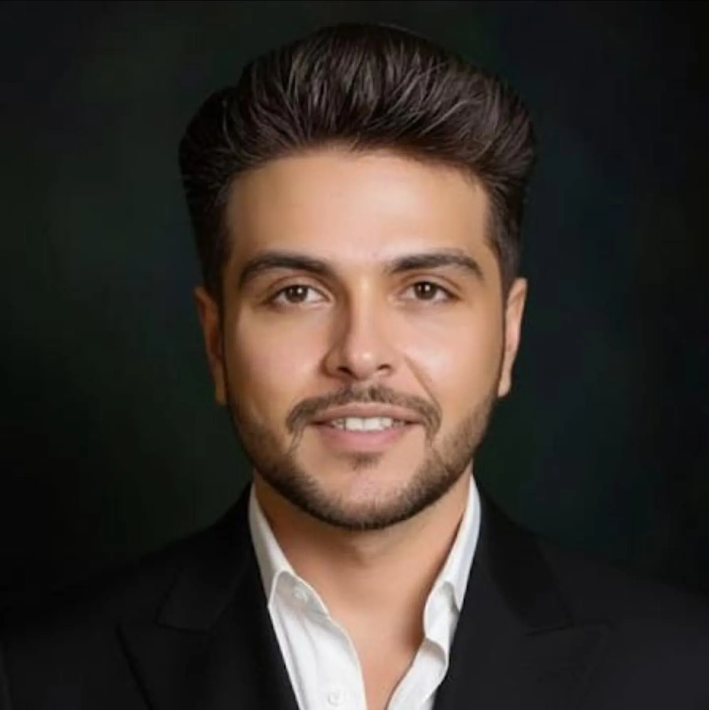 Portrait of Dawood Zulfiqar in a dark suit and white shirt
